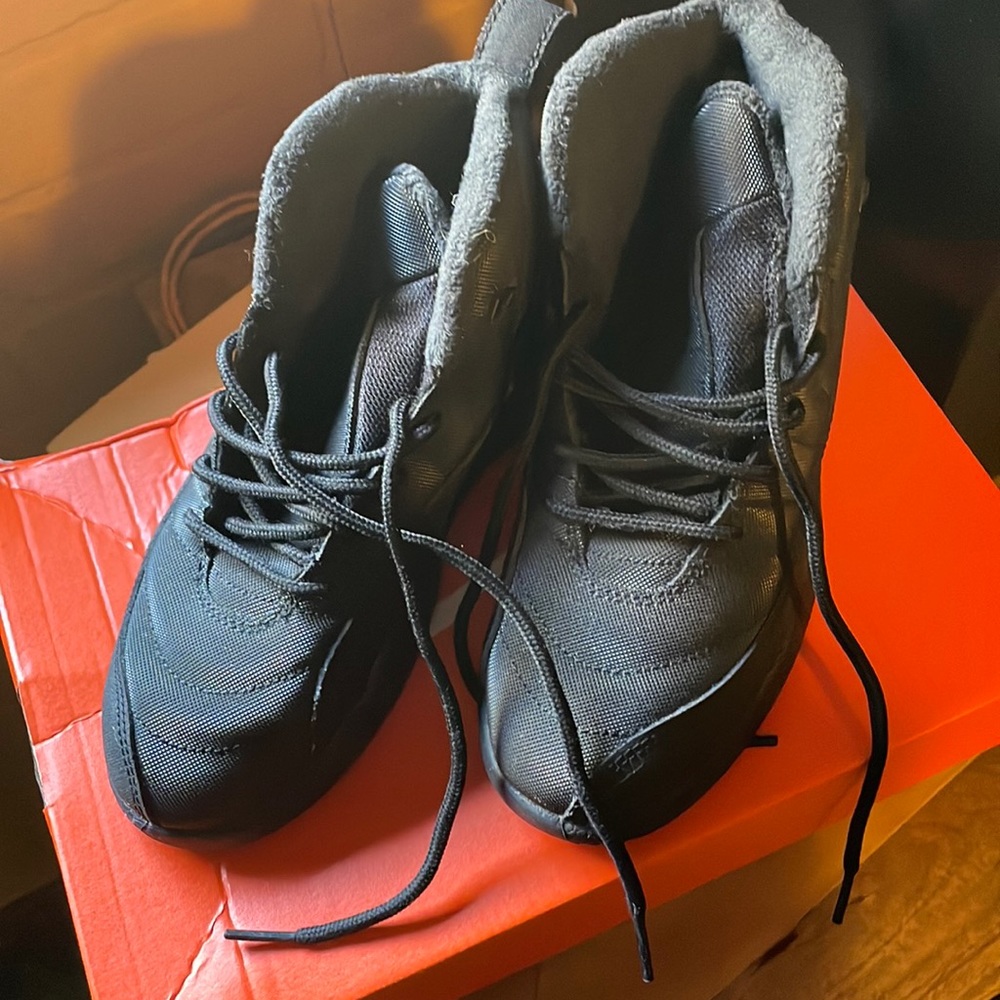 Brand new boys air Jordan.. black in color and size little boys 2.5. Never worn